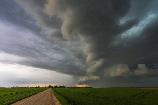 Dark storm rolling through the fields in Lithuania, dark supercell storm clouds