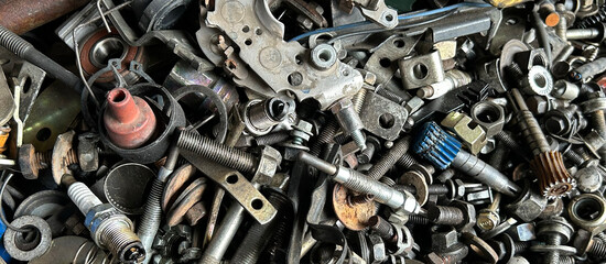 A pile of various metal tools and parts showcasing industrial detail and intricacy.