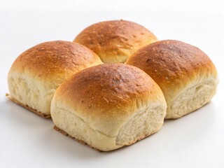 Golden-brown whole wheat bread rolls on a white background, soft and fluffy