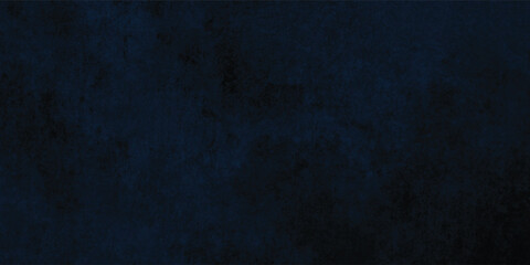 Abstract dark blue background with a rough, textured surface and subtle vintage feel.

