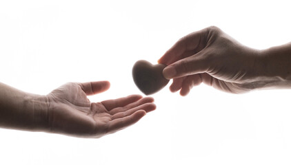 Adult hands giving a red heart, health care, organ donation, family life insurance, world heart day, world health day, praying concept.