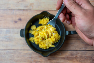 Scrambled eggs on a fork