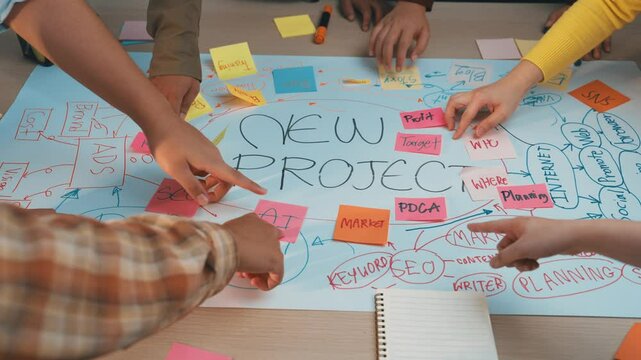 A vibrant scene depicting a collaborative brainstorming session for a new project, featuring hands working with colorful sticky notes on a table, capturing creative teamwork. SACTR