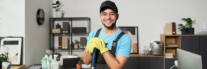 Header with worker doing cleaning work in office