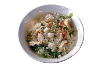 A bowl of warm chicken soto is served on the table