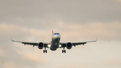 Majestic airplane approaching runway during twilight with dynamic clouds enhancing the dramatic sky