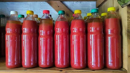 tomato juice preserved in the glass bottles