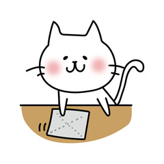 机を拭くお手伝いをする白い猫