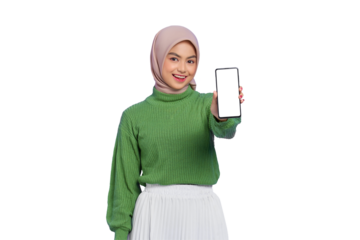 Smiling beautiful Asian woman in green sweater and hijab showing blank screen mobile phone isolated on transparent background