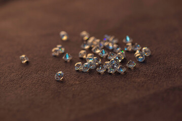 Sparkling Diamonds on Reflective Surface Close-up of sparkling diamonds placed on a reflective...