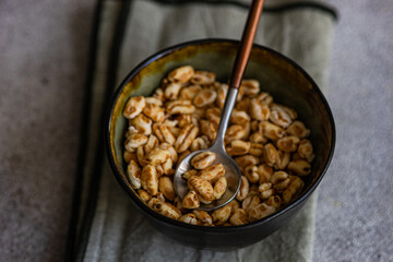 Healthy and tasty breakfast with cereals covered with caramel
