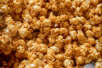 Sticky gooey caramel corn filling the frame