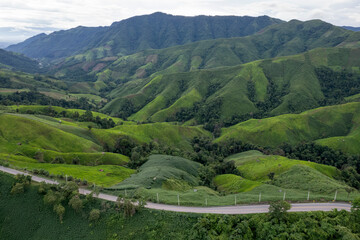 Landscape of Morning Mist with Mountain Layer. mountain ridge and clouds in rural jungle bush forest