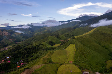 Landscape of Morning Mist with Mountain Layer. mountain ridge and clouds in rural jungle bush forest