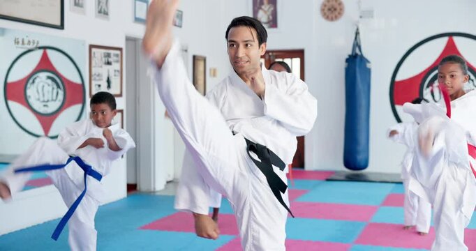 Kids, learning karate and training with instructor for fight, fitness or self defense class. Students, teacher and people practice martial arts for kick, punch or children exercise for lesson in dojo