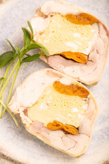 Chicken, egg and dried apricot meatloaf on brown concrete. Diet, healthy eating. side view, selective focus