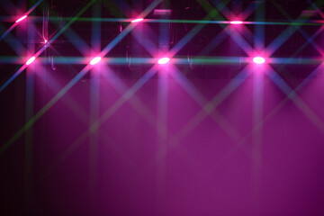 A purple background with lights on it. The lights are in different colors