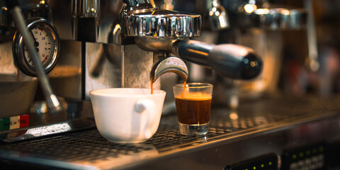 Brewing espresso in to glass cups silver coffee espresso machine