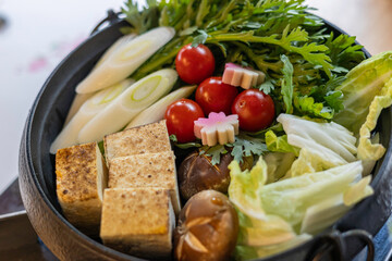 fresh vegetable, toufu and tomato in sukiyaki hot pot, Japanese style food, beef stew