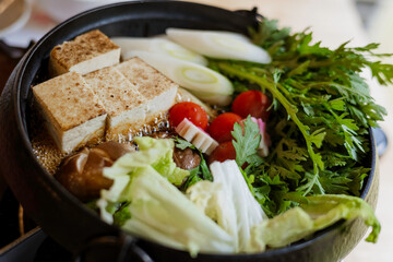 fresh vegetable, toufu and tomato in sukiyaki hot pot, Japanese style food