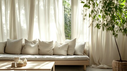 Bright living room with large windows, sheer curtains, and potted plants