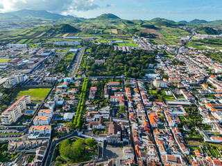 Obraz premium Rural landscape with farmlands and residential areas in Ponta Delgada, viewed from above