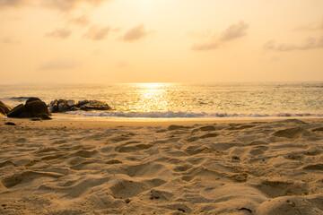 Background for summer vacation concept Nature of the beach and sea summer with sunset The sea sparkles against the sunset sky at sea