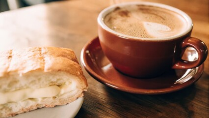 A glass of coffee with Kaya bread