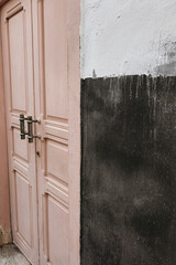 Close-Up of Pink Door and Wall Texture