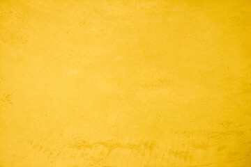 Yellow concrete stone texture for background in summer wallpaper. Cement and sand wall of tone vintage minimal. Concrete abstract wall of light yellow color, cement texture white blank for home decor.
