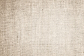 Fototapeta premium Brown sackcloth woven texture background in natural pattern. Jute hessian burlap, linen background in light beige cream color blank. Weaving canvas fiber line cotton cloth textured as organic.