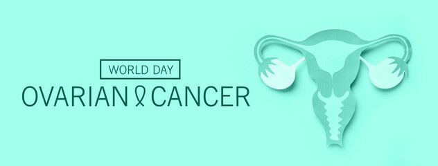 Paper uterus on turquoise background