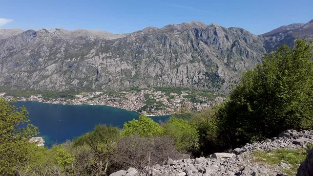 View of the sunny, spring Bay of Kotor from Mount Vrmac. Panoramic view of the Bay of Kotor and magnificent mountains. The bay of the Adriatic Sea
