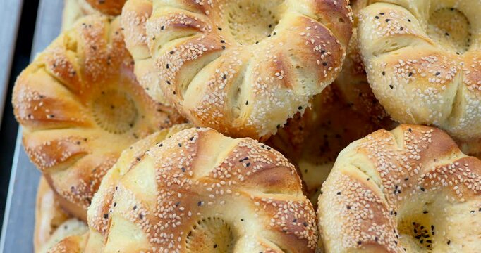 Freshly baked traditional Uzbek bread with sesame and poppy seeds