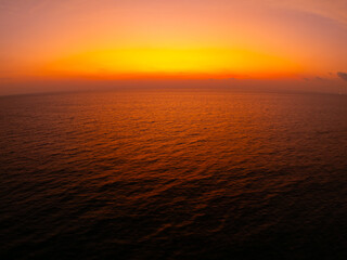 Naklejka premium Amazing sunset or sunrise sky over sea landscape,Beautiful colorful light of nature background,Drone camera shot nature view seascape