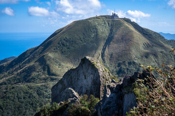 Cao Shan mountain in the cloudy day, sunlight shines between the cloud, in New Taipei City, Taiwan.
