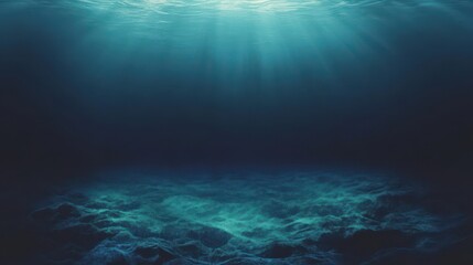 Obraz premium Underwater scene showcasing sunlight penetrating deep ocean depths.
