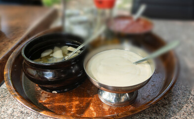 Vietnamese sauces set on the table in a street restaurant closeup. Mayonnaise, garlic dressing