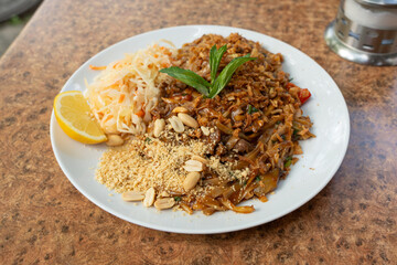 Pad thai or phad tha asian noodles closeup. Chinese rice pasta, phat thai with meat, noodles
