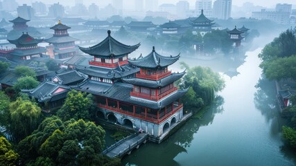 Obraz premium A serene traditional Chinese landscape with fog and water.