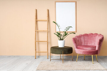 Interior of living room with wooden ladder, armchair and blank frame
