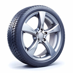 Obraz premium Car Wheel Isolated on White Background, Featuring a Sleek Rim Design and Sturdy Tire