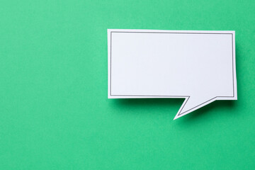 Blank speech bubble on green background, top view. Space for text