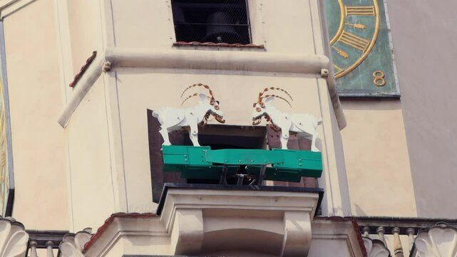 Poznań Goats tourist attraction. Mechanical goats butting heads on clock tower of the Poznan City Hall. Town Hall, Old Market Square.