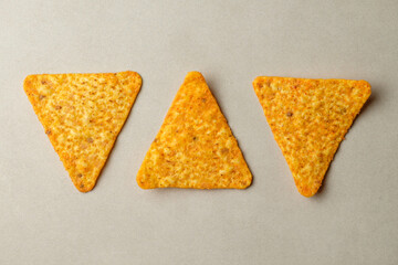 Delightful nacho chips arranged in playful geometric patterns and vibrant colors