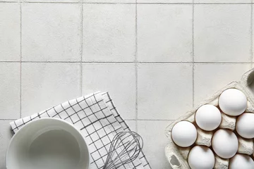 Fototapete Rund Holder with raw chicken eggs on white tile background © Pixel-Shot