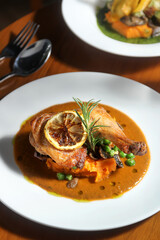 a plate of lemon herb chicken