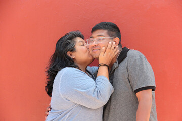 A 50-year-old divorced single mother and her 30-year-old dark-skinned Latino son show their love and celebrate Mother's Day together