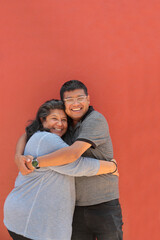 A 50-year-old divorced single mother and her 30-year-old dark-skinned Latino son show their love and celebrate Mother's Day together