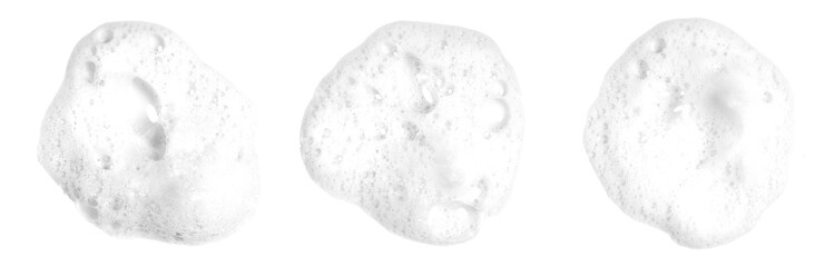 Liquid white foam from soap, shampoo or bath foam. Abstract soap bubbles. Set of soap bubbles. Separated soap bubbles on white background with contrasting texture.	
